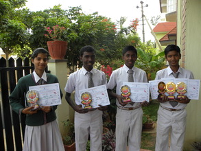 Children with certificates and trophies