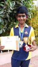 Dayanand posing with his achievements