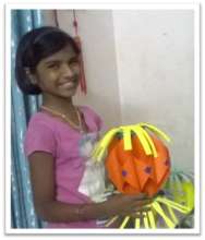 Saraswathi with the lantern she made