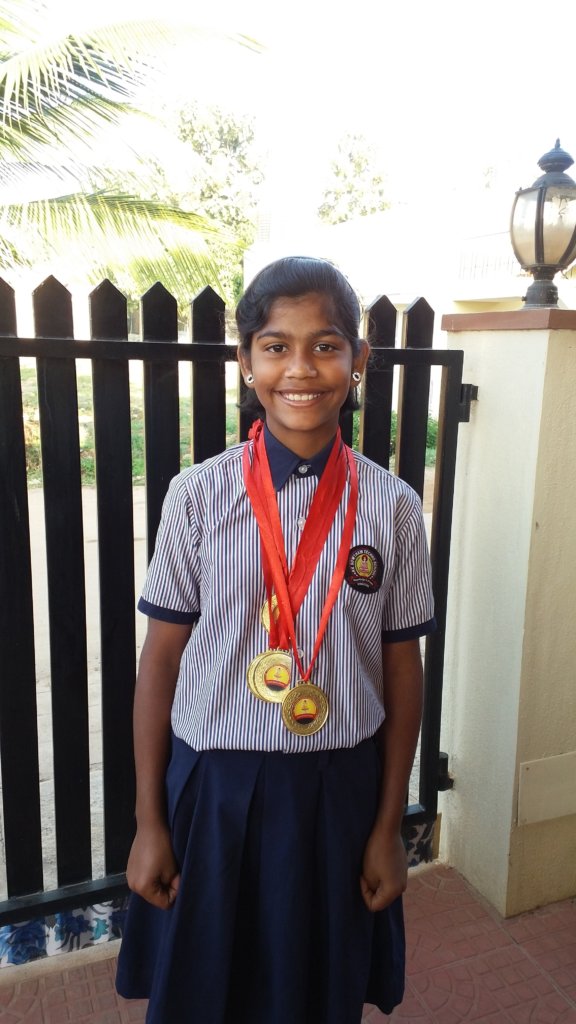 Pooja with her gold medals