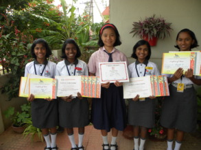 Girls Posing with their medals from Sports Day