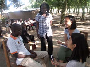 GROW Team members talk with a male role model