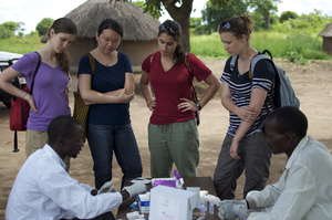 Denis teaches GROW interns about rapid HIV testing