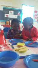 Little ones preparing their snack for the day