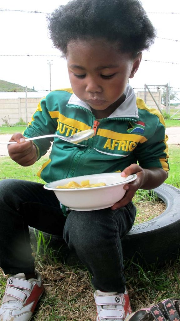 Sinaza, tasting her first bite of fruit salad