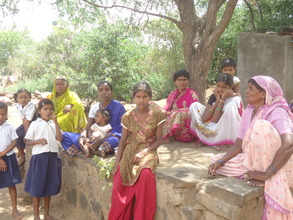 Women and children in the shade
