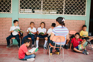 Primary students engaged in literacy activities