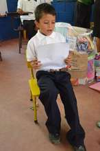 Fabretto student Melvin reads a story in class