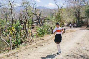 Brenda reads as she walks home