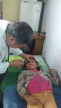 Dr. Valle checking student at Los Patojos