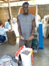 Arthur showing Self-Help his recycling business