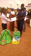 Emmanuel receiving his award