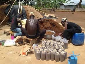 Mamuna, Awudu, & Zakaria bagging compost