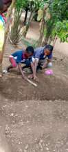 Innocent tending his garden.