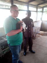 with an officer at a prisoner's camp