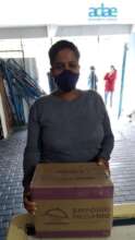 MOTHER RECEIVING FOOD BASKET