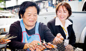 Micro-finance program manager and client.