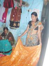 Baby helping her daughter-in-law for self reliance