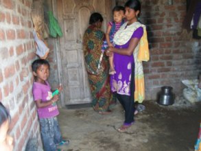 Opening door of her newly constructed home