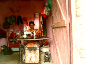 Kamal sewing clothes on her repaired machine