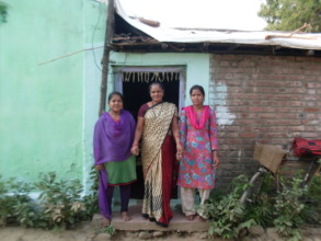 Surekha at home with her two daughters