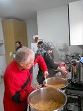 Fr. Bruno cooking for the kids