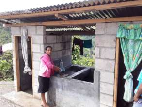 Senora Delmira S. at the latrine and wash station