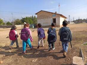 The road to school is exciting with new backpacks.