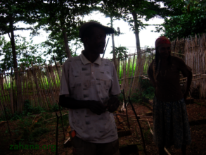 Jean with his wife in his backyard nursery