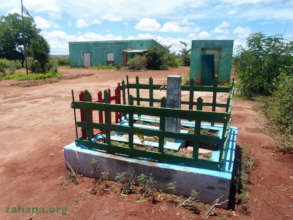 The finished fenced it school yard water faucet