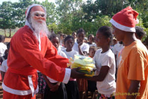 Santa brings uniforms for the school's soccer team