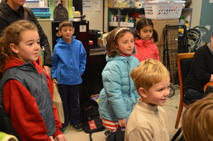 Junior volunteers delivering backpacks & supplies