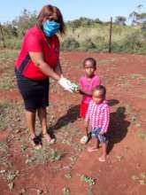 Siyabonga staff member delivering soap