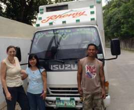 Vicki, Cecille & Tano; truck of medical supply