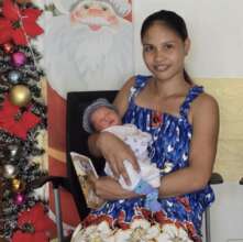 The happiness of a new baby at Christmastime