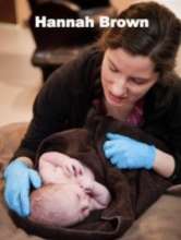 Hannah Brown examining a newborn baby