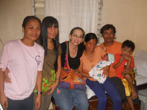 A happy new family surrounded by Mercy Midwives
