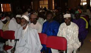 Men participate in community meeting