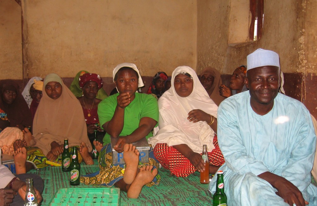 Community dialogue attended by men and women