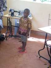 children being fitted with new clothes
