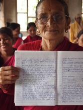 Proudly showing off her written work