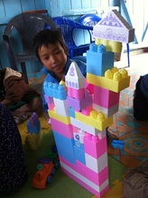 Playing with toys at the mini-library!