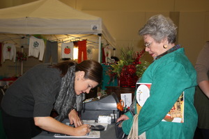 AWBC Mistletoe Market vendor makes sale
