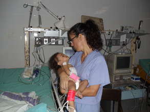 Little Glacy held by U.S. Nurse Jill