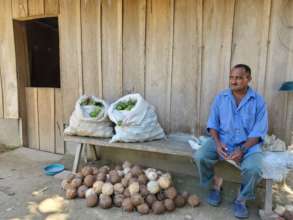 Farmer Jose with lemons and coconuts for market