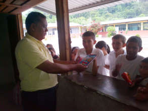 Students receiving the school supplies!