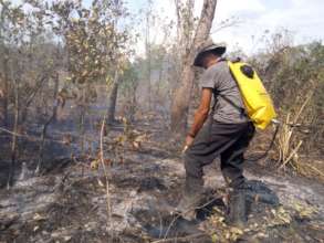 Fighting a fire with backpack style fire pump