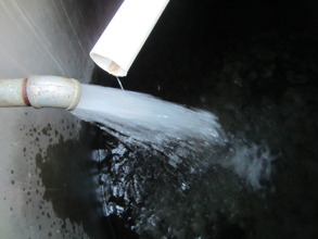 Clean water gushing to a water tank.