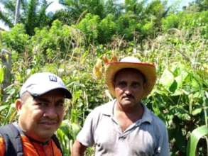 Victor Daniel, the author, with a farmer