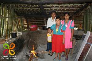 Victor and family in their open fire kitchen